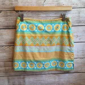 SYDNEY ELIZABETH SKORT IN YELLOW AND TEAL PRINT‎